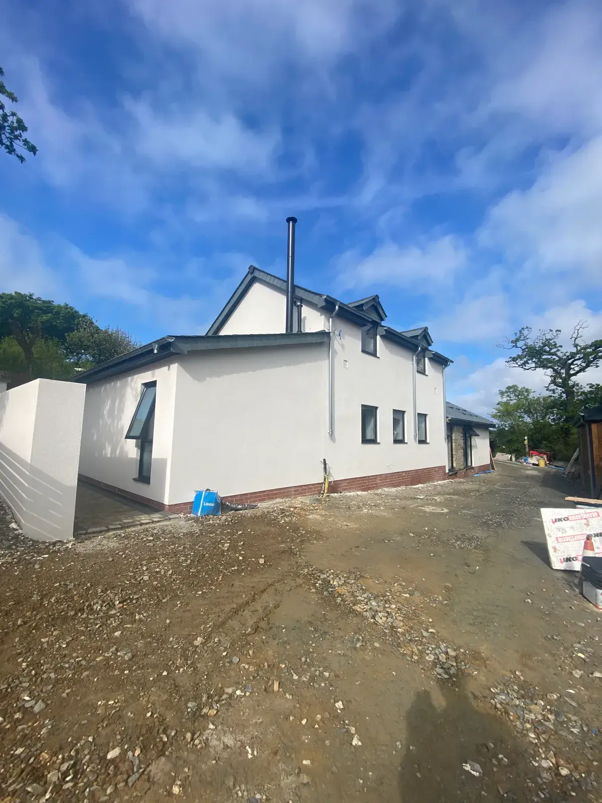 Bungalow finished in smooth white silicone render