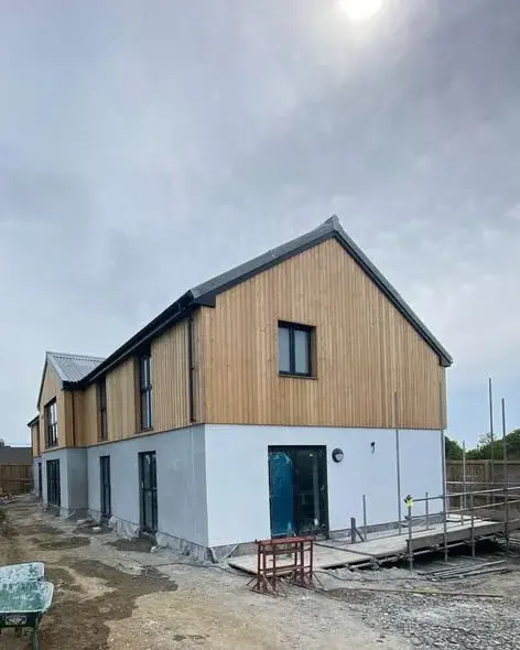 Render alongside timber cladding on a new build